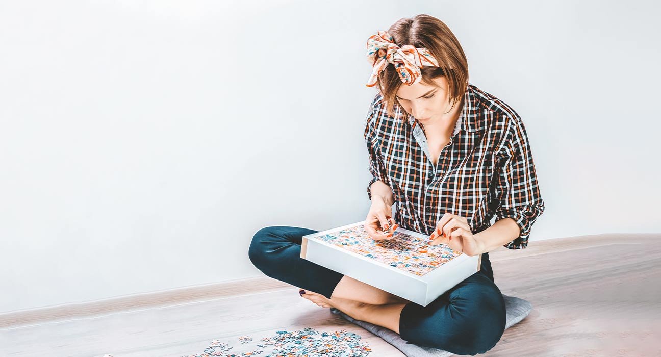 A girl playing with puzzle