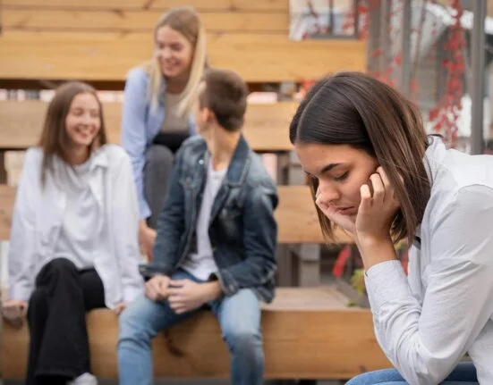 A Girl feels bad while sitting alone