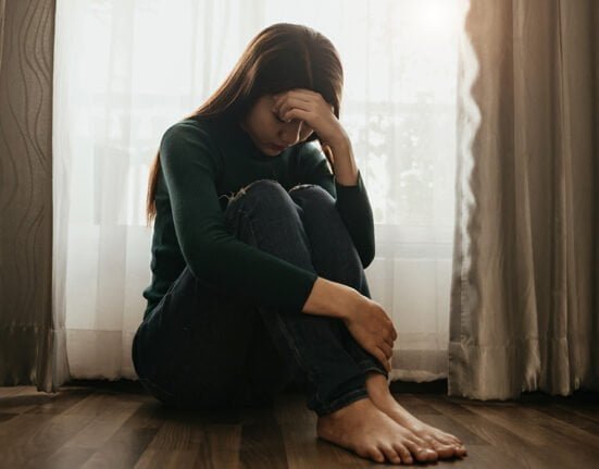 A girl sitting depressed