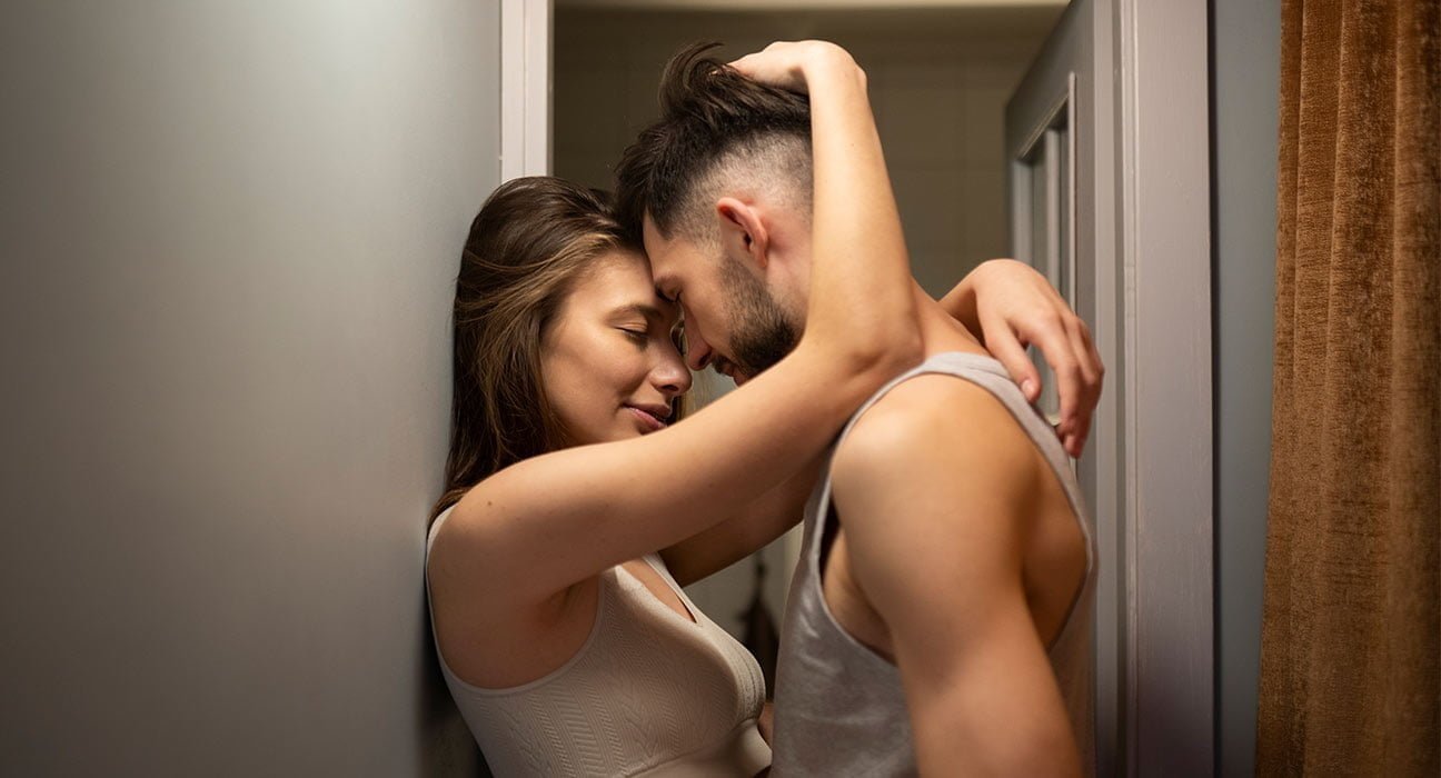 A boy and Girl standing in intimate pose