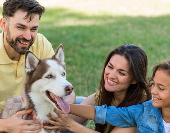 A happy family with the dog