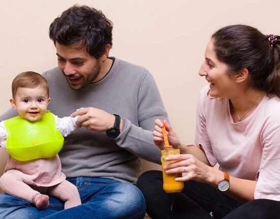 parents with news born baby