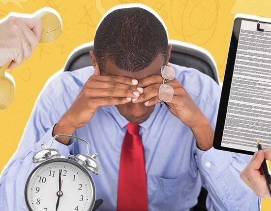 A man sitting stressed in his office